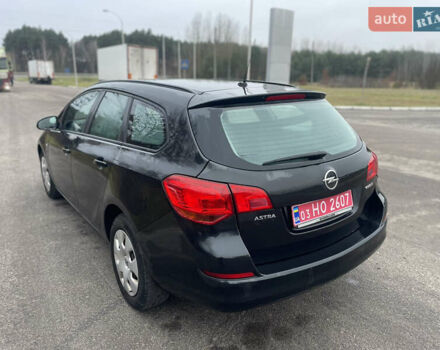 Черный Опель Астра, объемом двигателя 1.4 л и пробегом 210 тыс. км за 5900 $, фото 7 на Automoto.ua