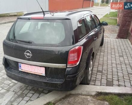 Черный Опель Астра, объемом двигателя 1.69 л и пробегом 260 тыс. км за 5600 $, фото 1 на Automoto.ua
