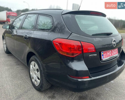 Черный Опель Астра, объемом двигателя 1.4 л и пробегом 210 тыс. км за 5900 $, фото 11 на Automoto.ua