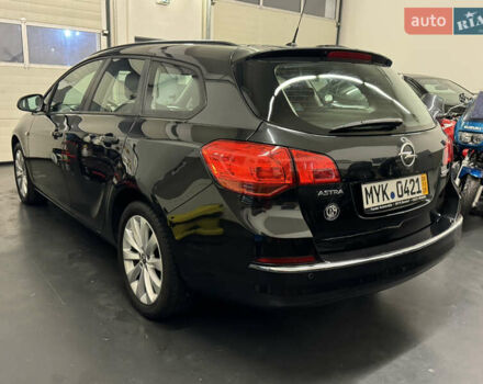 Черный Опель Астра, объемом двигателя 1.4 л и пробегом 203 тыс. км за 7250 $, фото 4 на Automoto.ua