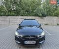 Черный Опель Астра, объемом двигателя 1.6 л и пробегом 230 тыс. км за 9899 $, фото 1 на Automoto.ua