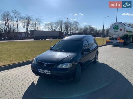 Черный Опель Астра, объемом двигателя 1.7 л и пробегом 176 тыс. км за 1550 $, фото 1 на Automoto.ua