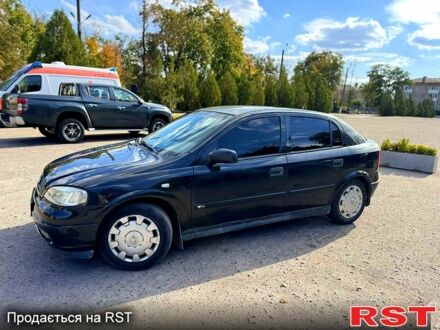 Черный Опель Астра, объемом двигателя 1.6 л и пробегом 256 тыс. км за 3000 $, фото 1 на Automoto.ua