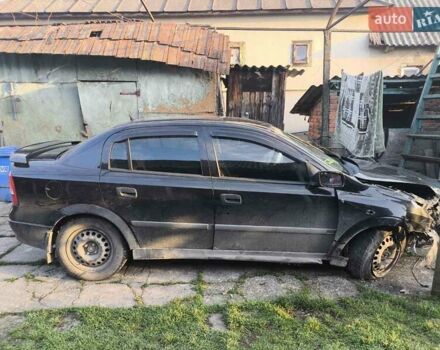 Черный Опель Астра, объемом двигателя 1.4 л и пробегом 200 тыс. км за 800 $, фото 1 на Automoto.ua