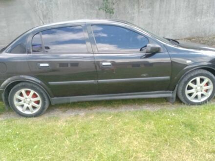 Черный Опель Астра, объемом двигателя 1.4 л и пробегом 243 тыс. км за 3200 $, фото 1 на Automoto.ua