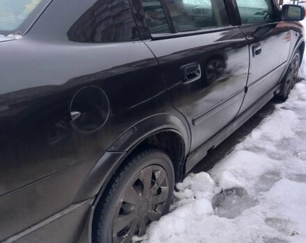 Черный Опель Астра, объемом двигателя 1.4 л и пробегом 236 тыс. км за 3100 $, фото 1 на Automoto.ua