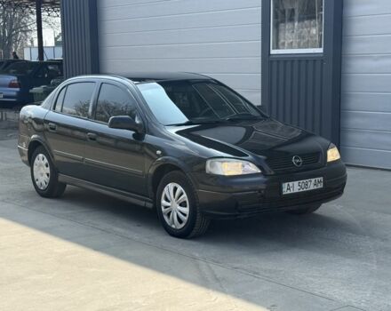 Черный Опель Астра, объемом двигателя 1.4 л и пробегом 210 тыс. км за 2350 $, фото 1 на Automoto.ua