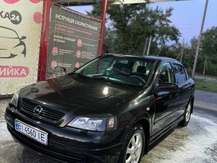Черный Опель Астра, объемом двигателя 1.4 л и пробегом 215 тыс. км за 3500 $, фото 1 на Automoto.ua