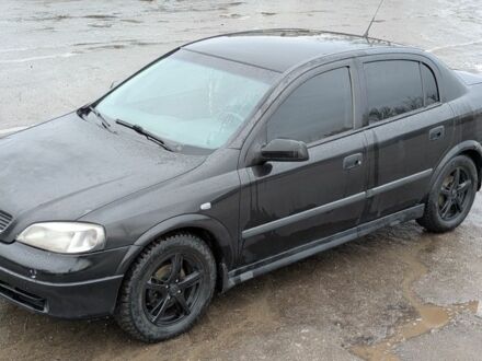 Черный Опель Астра, объемом двигателя 1.4 л и пробегом 324 тыс. км за 3000 $, фото 1 на Automoto.ua