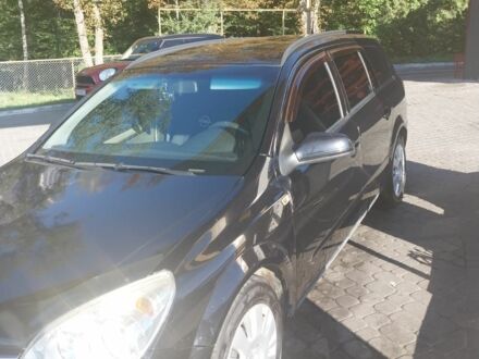 Черный Опель Астра, объемом двигателя 1.6 л и пробегом 180 тыс. км за 5000 $, фото 1 на Automoto.ua