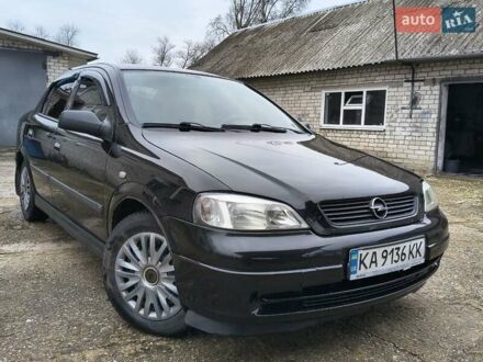 Черный Опель Астра, объемом двигателя 1.4 л и пробегом 250 тыс. км за 3999 $, фото 1 на Automoto.ua