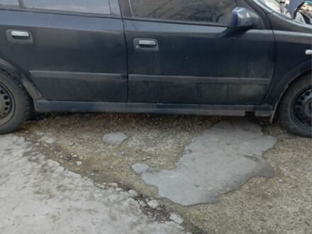 Черный Опель Астра, объемом двигателя 1.4 л и пробегом 171 тыс. км за 809 $, фото 1 на Automoto.ua