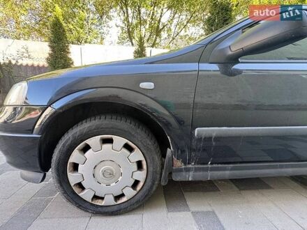 Чорний Опель Астра, об'ємом двигуна 1.39 л та пробігом 142 тис. км за 3500 $, фото 1 на Automoto.ua