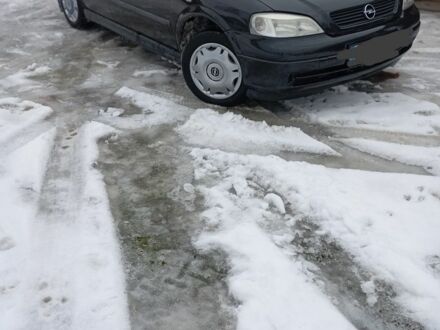 Черный Опель Астра, объемом двигателя 1.4 л и пробегом 270 тыс. км за 3100 $, фото 1 на Automoto.ua
