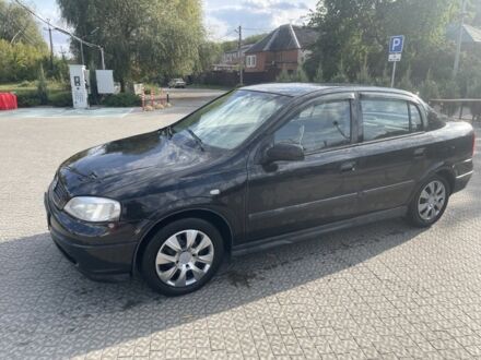 Черный Опель Астра, объемом двигателя 1.4 л и пробегом 212 тыс. км за 4000 $, фото 1 на Automoto.ua