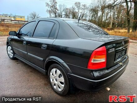 Черный Опель Астра, объемом двигателя 1.4 л и пробегом 230 тыс. км за 4200 $, фото 1 на Automoto.ua