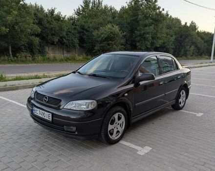 Черный Опель Астра, объемом двигателя 1.6 л и пробегом 215 тыс. км за 3900 $, фото 1 на Automoto.ua