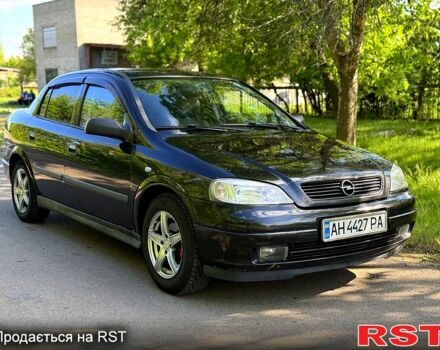 Черный Опель Астра, объемом двигателя 1.4 л и пробегом 140 тыс. км за 4000 $, фото 1 на Automoto.ua