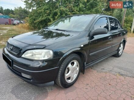 Черный Опель Астра, объемом двигателя 1.6 л и пробегом 230 тыс. км за 4200 $, фото 1 на Automoto.ua
