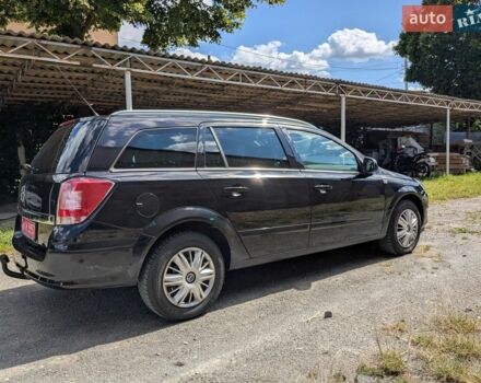 Черный Опель Астра, объемом двигателя 1.6 л и пробегом 210 тыс. км за 4990 $, фото 1 на Automoto.ua