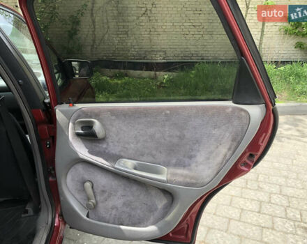 Красный Опель Астра, объемом двигателя 1.6 л и пробегом 332 тыс. км за 2100 $, фото 29 на Automoto.ua
