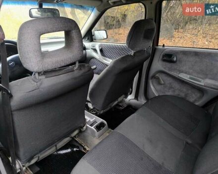 Красный Опель Астра, объемом двигателя 1.8 л и пробегом 200 тыс. км за 905 $, фото 3 на Automoto.ua