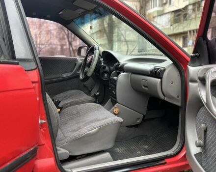 Красный Опель Астра, объемом двигателя 1.4 л и пробегом 300 тыс. км за 999 $, фото 4 на Automoto.ua