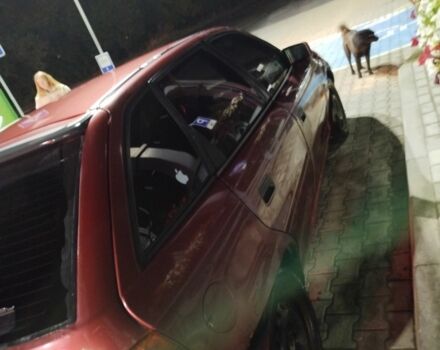 Красный Опель Астра, объемом двигателя 1.6 л и пробегом 317 тыс. км за 1100 $, фото 5 на Automoto.ua