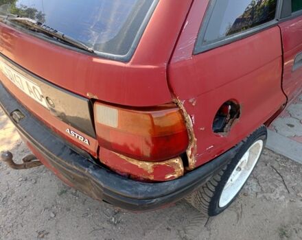 Красный Опель Астра, объемом двигателя 1.4 л и пробегом 396 тыс. км за 700 $, фото 2 на Automoto.ua