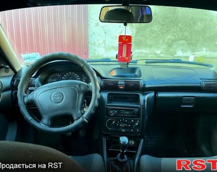 Червоний Опель Астра, об'ємом двигуна 1.4 л та пробігом 348 тис. км за 2500 $, фото 6 на Automoto.ua