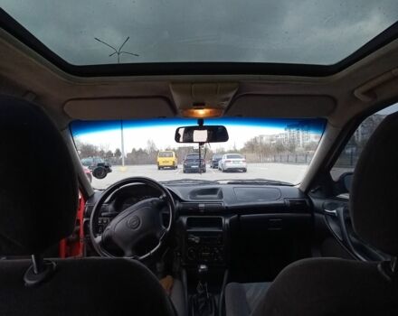 Красный Опель Астра, объемом двигателя 1.6 л и пробегом 396 тыс. км за 1299 $, фото 9 на Automoto.ua