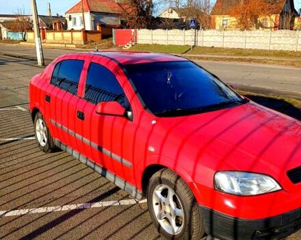 Красный Опель Астра, объемом двигателя 1.4 л и пробегом 402 тыс. км за 3000 $, фото 5 на Automoto.ua