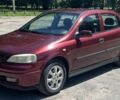 Красный Опель Астра, объемом двигателя 1.6 л и пробегом 290 тыс. км за 3000 $, фото 1 на Automoto.ua