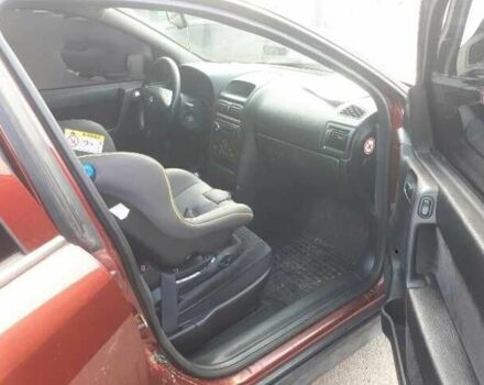 Красный Опель Астра, объемом двигателя 1.6 л и пробегом 181 тыс. км за 4900 $, фото 4 на Automoto.ua