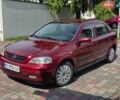 Красный Опель Астра, объемом двигателя 1.39 л и пробегом 231 тыс. км за 2350 $, фото 1 на Automoto.ua
