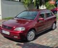 Красный Опель Астра, объемом двигателя 1.39 л и пробегом 231 тыс. км за 2350 $, фото 1 на Automoto.ua