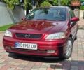 Красный Опель Астра, объемом двигателя 1.39 л и пробегом 231 тыс. км за 2650 $, фото 1 на Automoto.ua