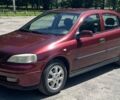Красный Опель Астра, объемом двигателя 1.6 л и пробегом 290 тыс. км за 3000 $, фото 1 на Automoto.ua