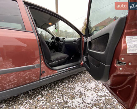 Красный Опель Астра, объемом двигателя 1.2 л и пробегом 327 тыс. км за 3200 $, фото 6 на Automoto.ua