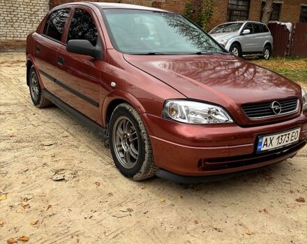 Красный Опель Астра, объемом двигателя 1.4 л и пробегом 250 тыс. км за 2800 $, фото 1 на Automoto.ua