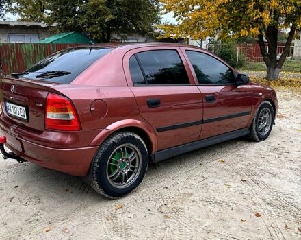 Красный Опель Астра, объемом двигателя 1.4 л и пробегом 250 тыс. км за 2800 $, фото 3 на Automoto.ua