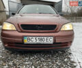 Красный Опель Астра, объемом двигателя 1.2 л и пробегом 327 тыс. км за 3200 $, фото 2 на Automoto.ua