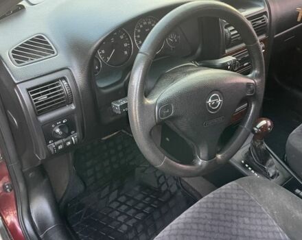 Красный Опель Астра, объемом двигателя 1.6 л и пробегом 270 тыс. км за 4000 $, фото 2 на Automoto.ua