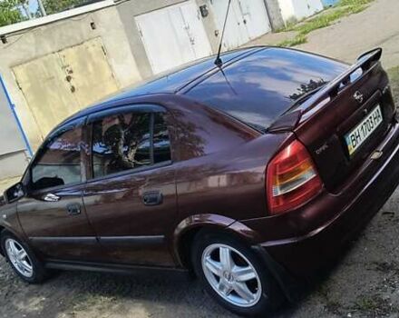 Красный Опель Астра, объемом двигателя 1.39 л и пробегом 210 тыс. км за 4400 $, фото 3 на Automoto.ua