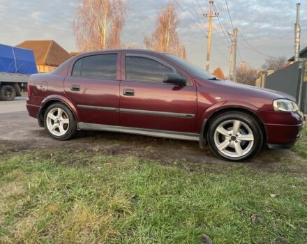 Красный Опель Астра, объемом двигателя 1.6 л и пробегом 270 тыс. км за 4000 $, фото 1 на Automoto.ua