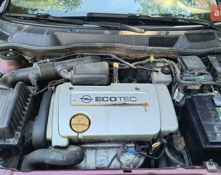 Красный Опель Астра, объемом двигателя 1.39 л и пробегом 210 тыс. км за 4400 $, фото 11 на Automoto.ua