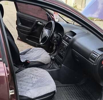 Красный Опель Астра, объемом двигателя 1.39 л и пробегом 210 тыс. км за 4400 $, фото 6 на Automoto.ua