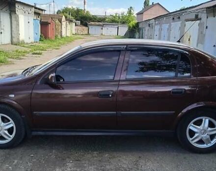 Красный Опель Астра, объемом двигателя 1.39 л и пробегом 210 тыс. км за 4400 $, фото 5 на Automoto.ua