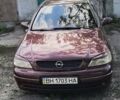 Красный Опель Астра, объемом двигателя 1.39 л и пробегом 210 тыс. км за 4400 $, фото 1 на Automoto.ua