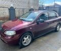 Красный Опель Астра, объемом двигателя 1.6 л и пробегом 300 тыс. км за 3500 $, фото 1 на Automoto.ua